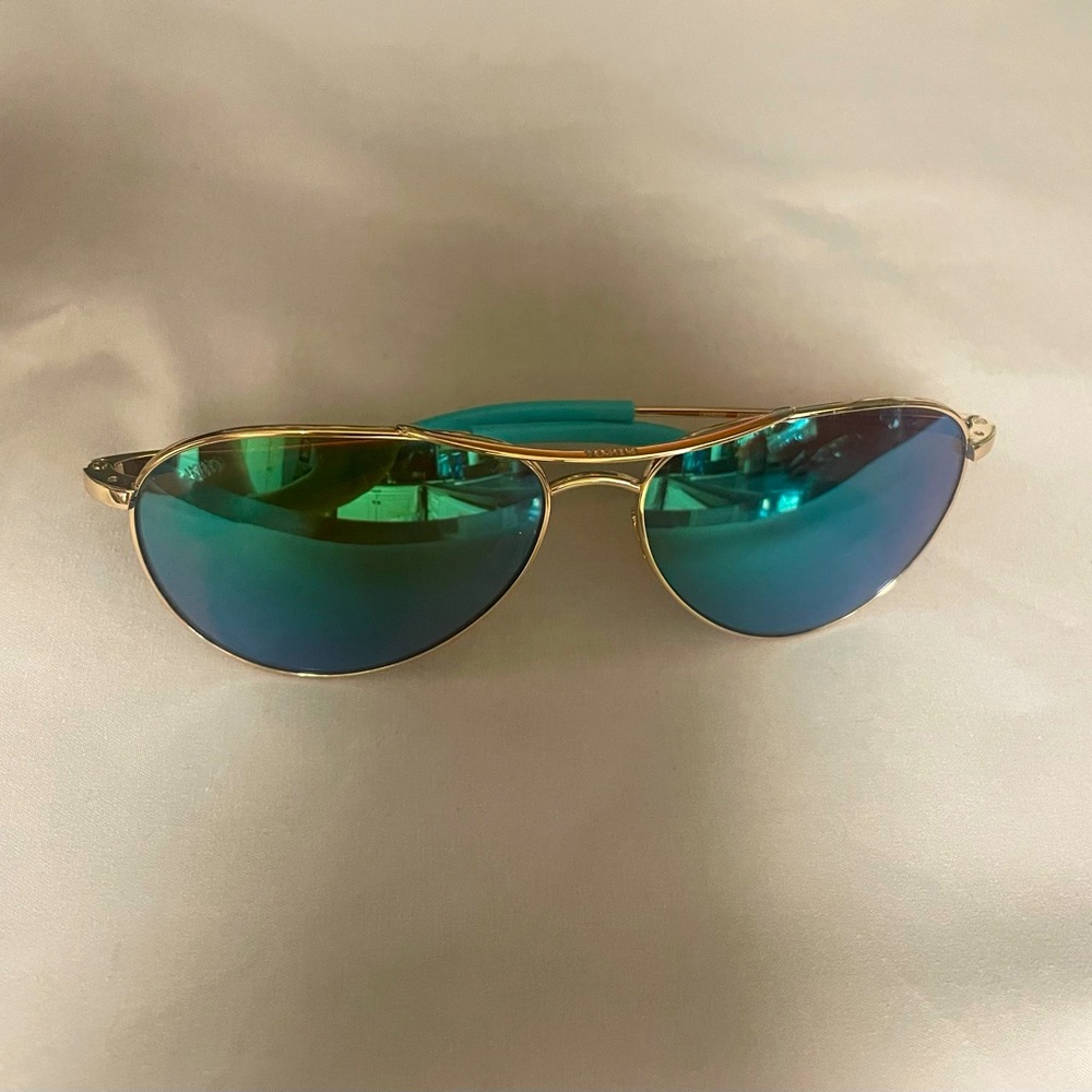 Costa Piper polarized Sunglasses In green mirror. Medium aviator style.